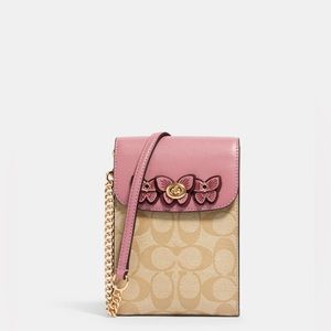 $250 Brand new with tags Coach pink butterfly phone chain crossbody